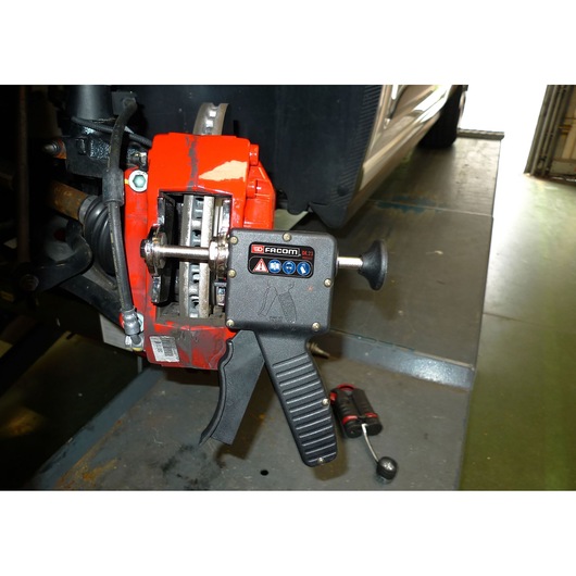 Brake pad spreader