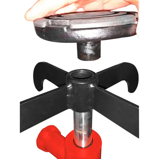 Facom DL_50 mechanical separator on white background, hand holding top metal part above base.