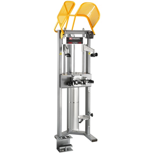 Facom DLS_501HP4T spring compressor with yellow safety guards, upright view, metal frame and adjustment knobs.