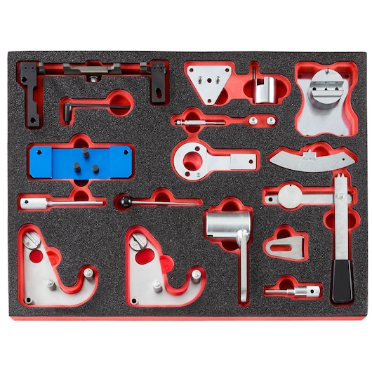 Facom DT.MODPR automotive timing tool set in foam organizer, top angle, with assorted metal components and blue plate.