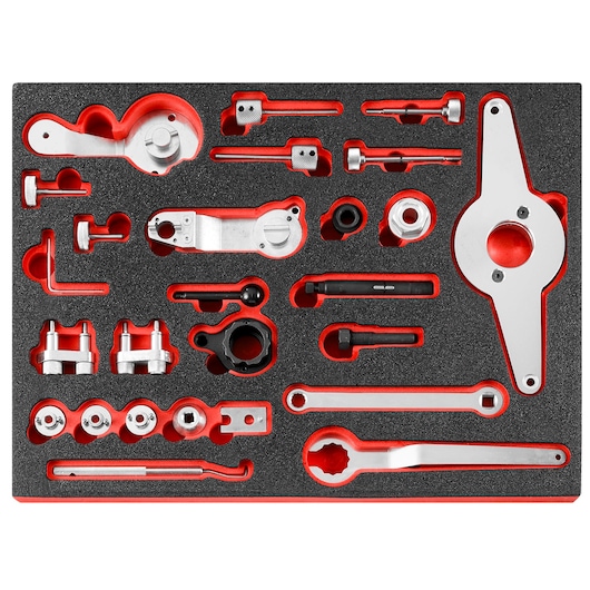 Facom DT.MODVW automotive timing tool kit, multiple silver metal tools in foam tray, top-down angle.
