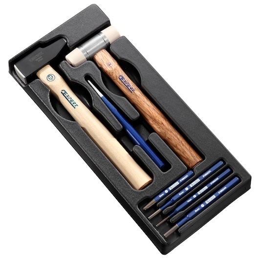 Facom E010501 hammer and punch set in black foam tray, two hammers and multiple punches, angled top view.
