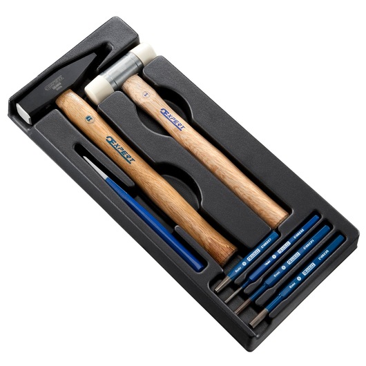 Facom E010506 tool set with hammer, mallet, and five blue-handled punches in black tray, top view.