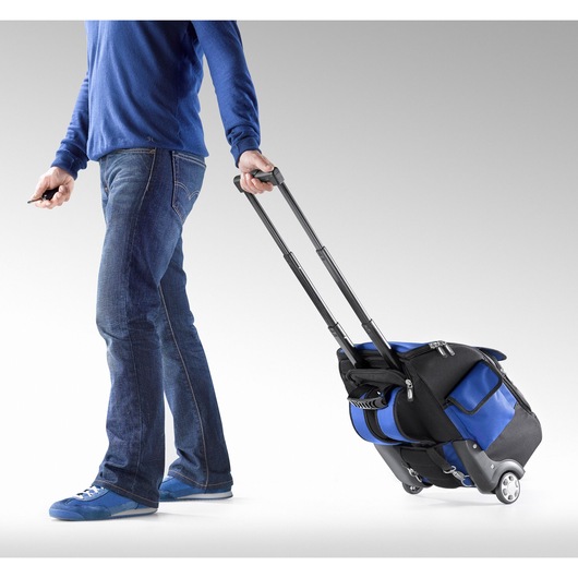 Facom E010602 rolling tool bag with telescopic handle, blue and black, side angle photo.