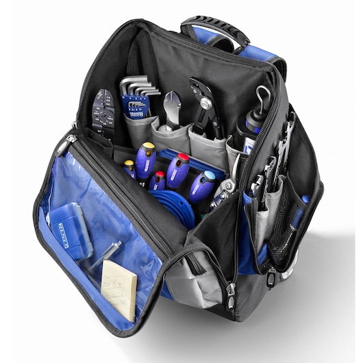 Facom E010602 tool bag with multiple hand tools and accessories, front angle photo on white background.