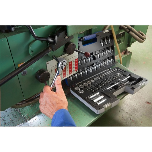 Facom E031806 ratchet socket set used on machinery, case open showing multiple sockets and accessories.