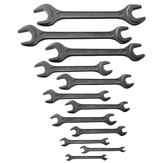 Photo of Facom E114040 open end wrench set, twelve black wrenches in various sizes arranged on white background.