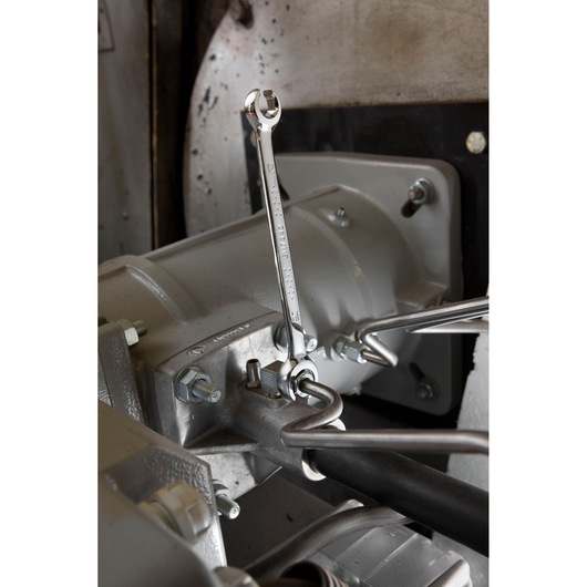 Facom E117368 combination wrench in use on industrial machinery, metallic finish, product photograph