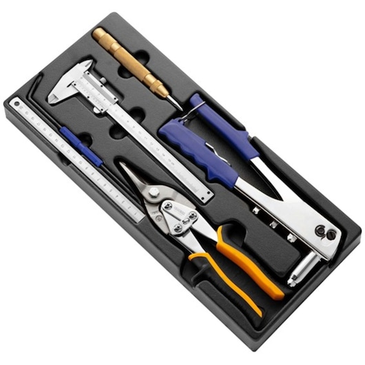 Facom E142401 tool tray with ruler, caliper, center punch, aviation snips, and hand riveter, angled on white.