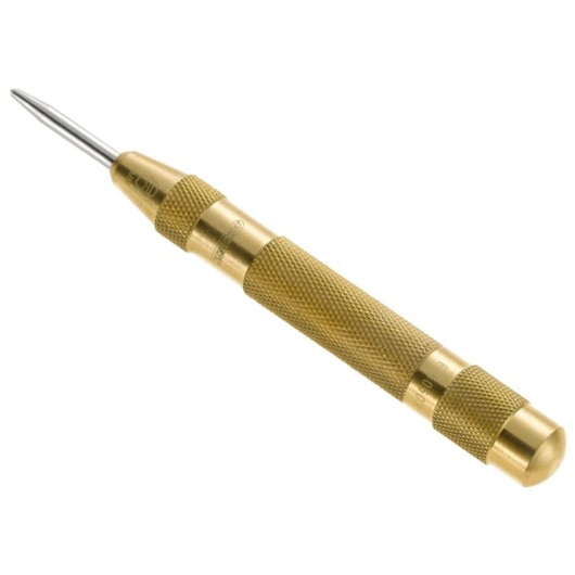 Facom E150503 automatic center punch with textured brass body, angled view on white background.