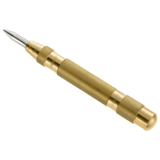 Facom E150504 brass automatic center punch with knurled grip, angled view on white background.
