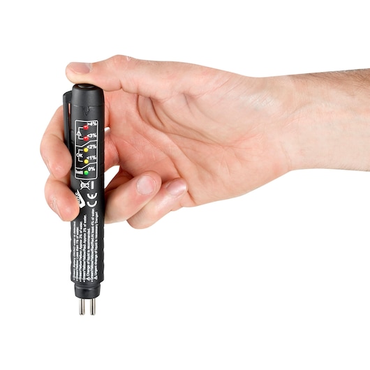 Facom E200910 electronic tester pen with indicator lights, held in hand, front angle on white background.