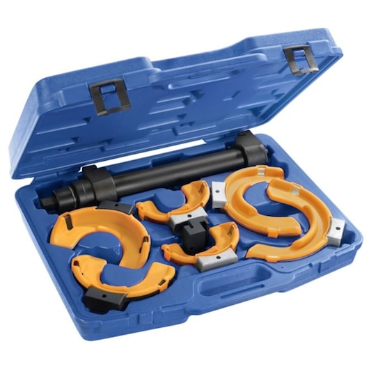 Photo of Facom E201001 coil spring compressor kit with yellow parts and black rod in a blue case, angled view.