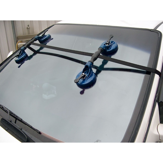 Facom E201503 windshield holder with suction cups mounted on car, front angle.