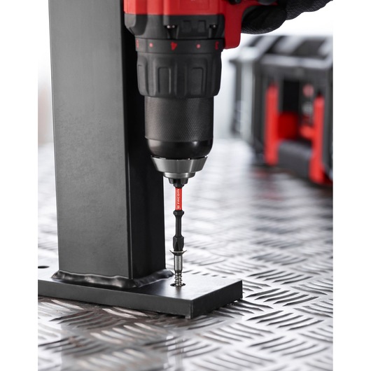 Facom EN_1J50PB drill bit in use on metal plate, close-up angle.