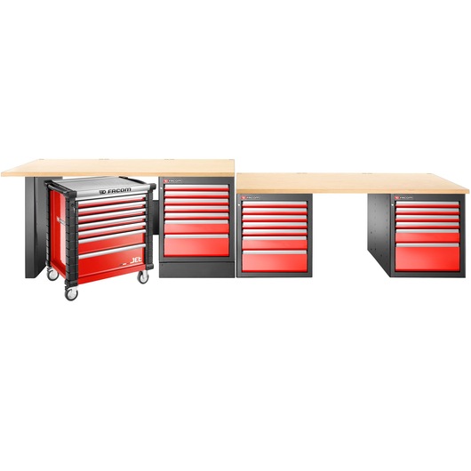 A Facom workbench setup with three wood-top work surfaces and multiple red and black tool storage cabinets, including a mobile tool chest on wheels.
