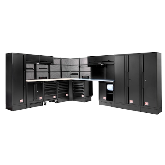 A modular black garage storage and workstation system with multiple tall cabinets, drawers, overhead storage, pegboard panels, and work surfaces. The layout is arranged in an L-shape.
