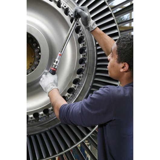 Photo of Facom J306A50 torque wrench being used on an aircraft engine turbine.