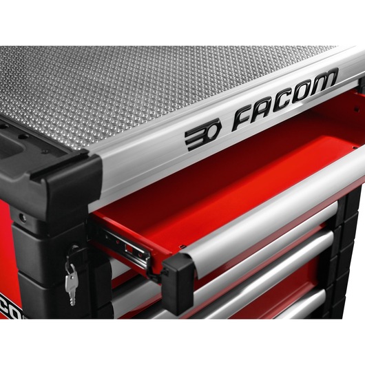 Facom JET.6M3A tool chest photography, close-up of red drawer and textured metal top, partial side view.