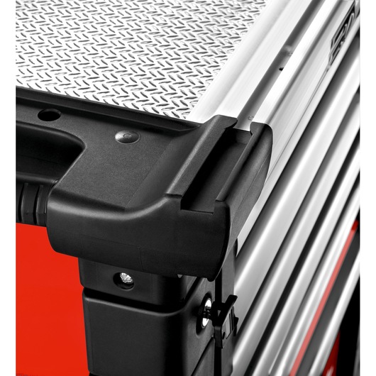 Facom JET.6M3A tool chest corner with black handle and textured metal top, close-up angle.