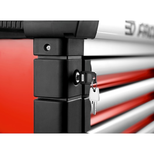 Facom JET.6M3A tool chest with keys in lock, close-up, red and silver drawers, white background.