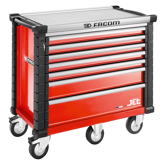 Facom JET.7M5A red tool cabinet with seven drawers on caster wheels, side handles, angled front, white background.