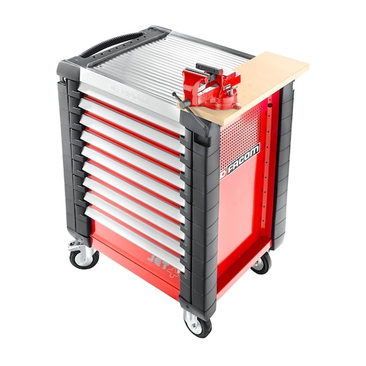 Facom JETA17 red and black tool cabinet with seven drawers, side vise, and caster wheels, front angle on white background.