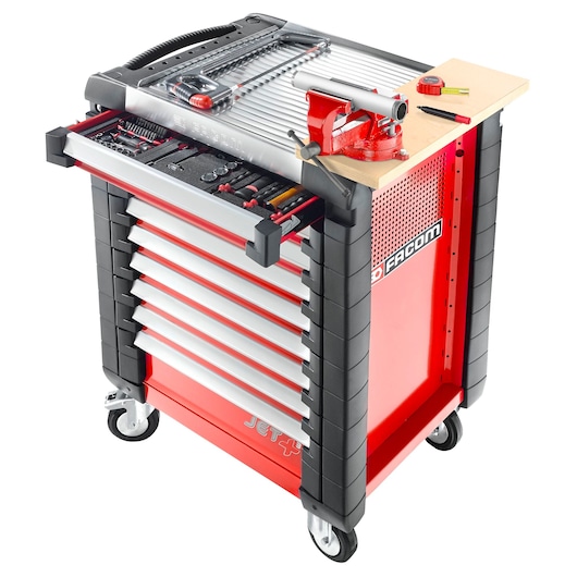 Facom JETA17 red tool trolley with multiple drawers, vise, and assorted tools, angled photo.