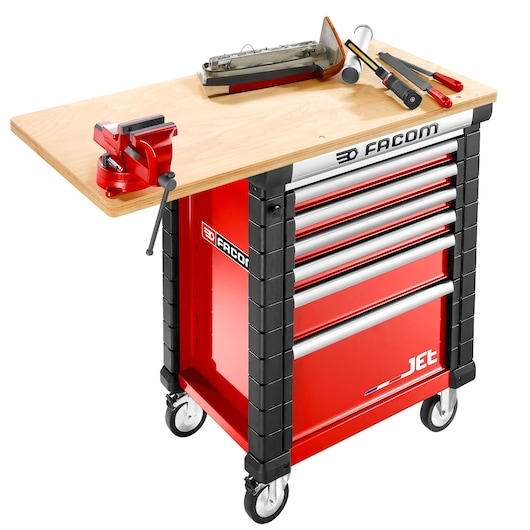 Photo of Facom JET.WA14M5 red tool cabinet with drawers, wood worktop, mounted vise, and assorted tools.