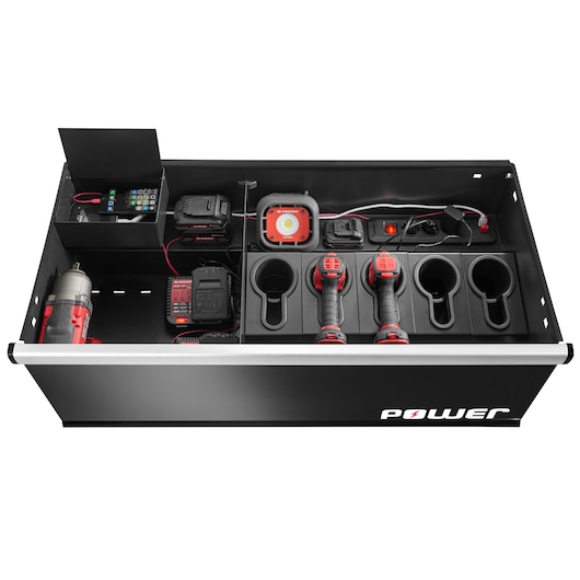 Facom JLS3-MBDPOWER drawer with charging station, red and black power tools, battery chargers, and sockets, top view.