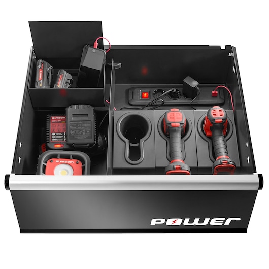 Photo of Facom JLS3-MBSPOWER tool storage drawer with power tools, chargers, batteries, and power strip, top view.