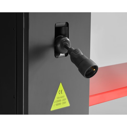 Facom JLS3-PSBPOWER power socket close-up showing black connector and yellow warning label on gray cabinet.
