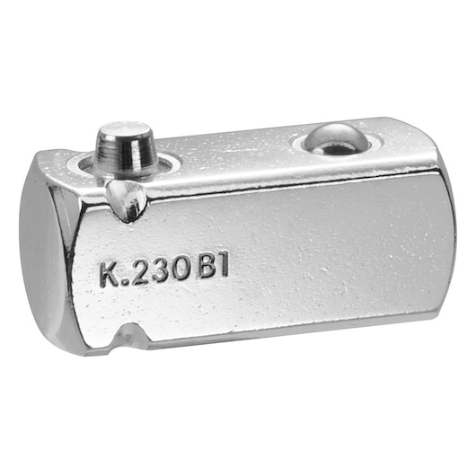 Photo of Facom K_230B1 chrome-finish tool accessory, rectangular metal adapter with embossed marking, angled view.