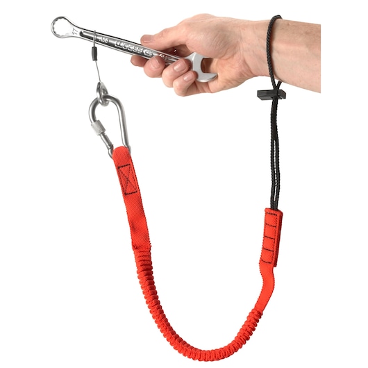 Photo of Facom LAN-WRT12 red elastic tool tether with carabiner and wrist strap, shown attached to a wrench.