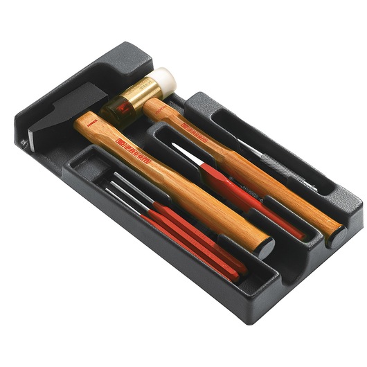 Facom MOD.MI1PB tool tray with two hammers and assorted punches, chisel, and drift pins, photographed at an angle on white.