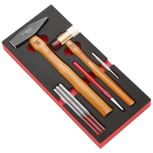 Facom MODM_MI3 tool set with wooden hammers and punches in black foam tray, angled top view.