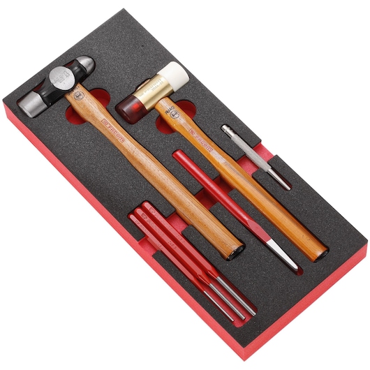 Photo of Facom MODM_MI4 hammer and punch tool set with wooden handles in black and red foam tray, top angle.