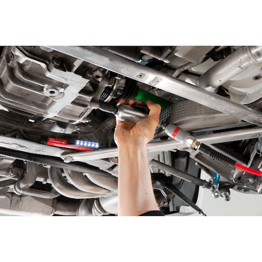 Facom NJ_1400F2 air tool used for automotive repair under a vehicle with a Facom LED work light.