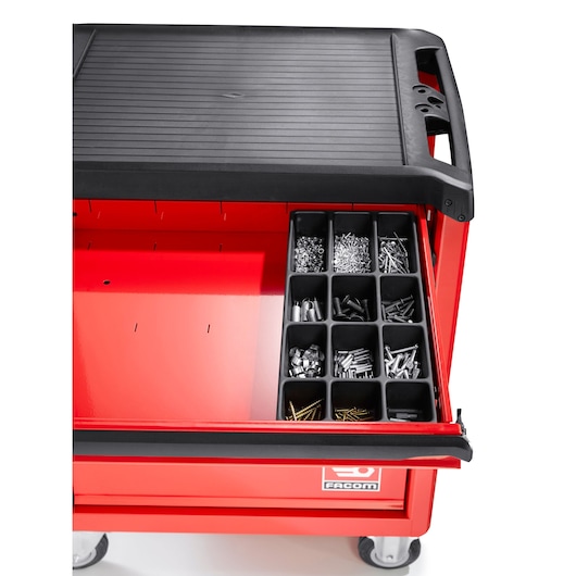 Facom red tool trolley PL_M384 with organized drawer of fasteners and small parts, top down view on white background.