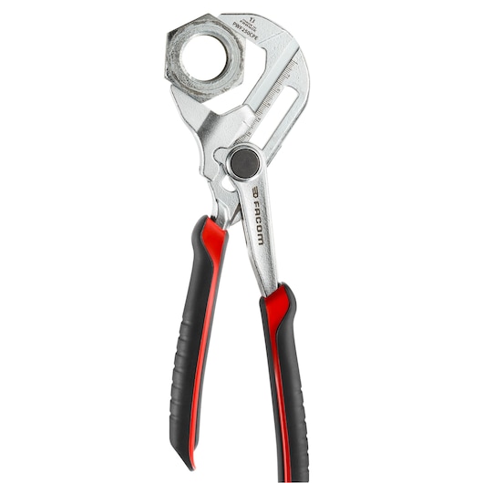 Photo of Facom PWF250CPEPB adjustable pliers with black and red handles gripping a large metal nut, front angle.
