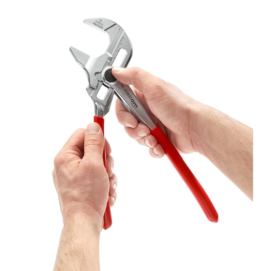 Facom PWF250G adjustable pliers with red handles held by hands, front angle, photography