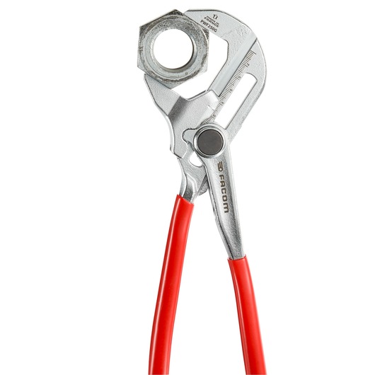Facom PWF250G water pump pliers with red handles, holding a metal nut, front angle.