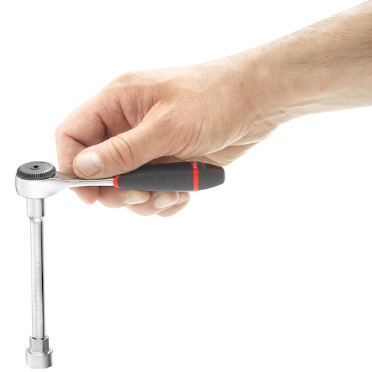 A hand holding a Facom R_161B ratchet wrench with a black and red handle, shown in use against a white background.