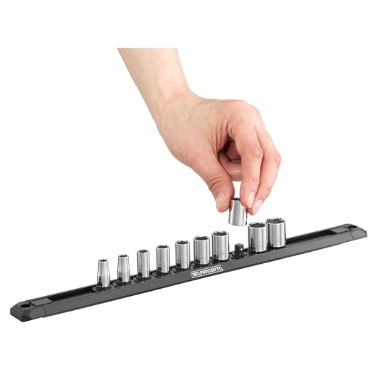 Facom socket set R.40EGRPPB on black rail with hand picking up a socket, photography on white background.