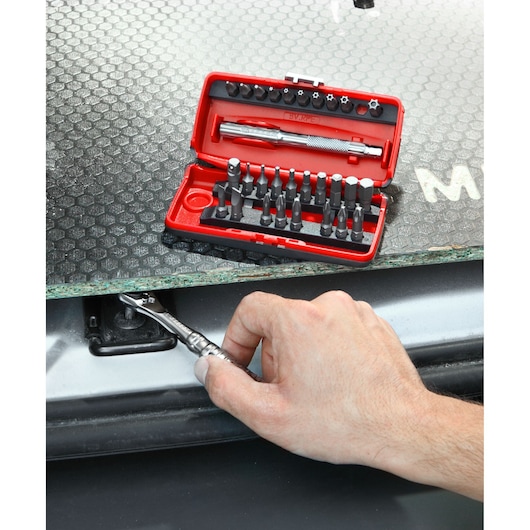 Facom R_PEJ31 precision screwdriver and bit set used for automotive repair, red case open with bits visible.