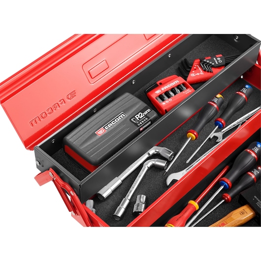 Photo of Facom R2NANO tool kit in a red metal box with assorted screwdrivers, wrenches, and hex keys, top-angle.