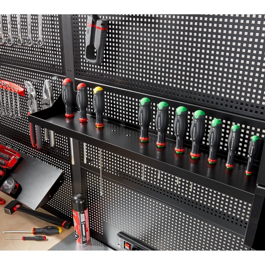 Facom RWS-SHELFBS tool shelf with multiple screwdrivers stored upright on a black perforated wall panel.