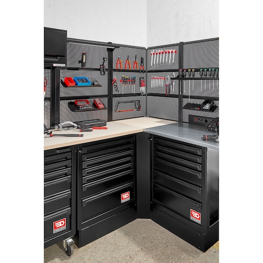 Facom RWS2-CSWBS photography of black corner tool chest with multiple drawers and pegboard tool storage.