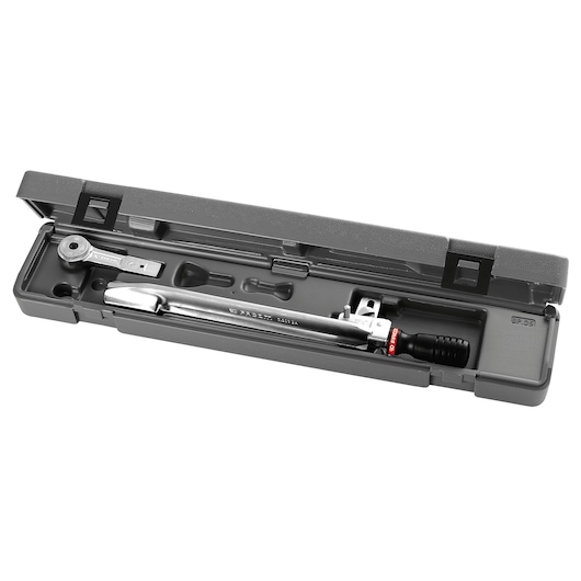A Facom torque wrench set in a grey plastic case, showing the wrench and additional accessories neatly organized inside.