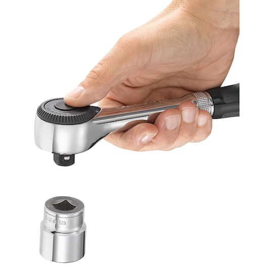 Facom S_360 ratchet in hand with chrome socket, front angle on white background.